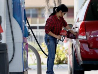 A customer pumps gas into her vehicle at a gas station on November 22, 2021 in Miami, Florida. Florida Governor Ron DeSantis announced he would ask state lawmakers to temporarily “zero out” state gas taxes next year. DeSantis said the approximately 25-cent-a-gallon “gas tax relief” proposal could save the average Florida family up to $200 over a five- to six-month period. (Photo by Joe Raedle/Getty Images)
