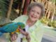 Betty White, longtime advocate of animal welfare, feeds a parrot at the Los Angeles Zoo in 2014. (Angela Weiss/Getty Images)