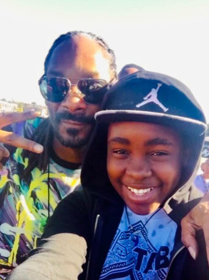 Young Ozie Nzeribe with the one-and-only Snoop Dogg. (Courtesy Randi Cone/Interdependence Public Relations)