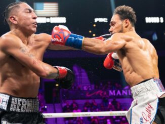 Keith Thurman (right) overcame a 31-month ring absence by dominating Saturday night's 147-pound clash of former champions, winning by unanimous decision over Mario Barrios (left) despite injury his left hand in the third round. (Ryan Hafey/Premier Boxing Champions)