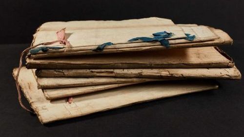 Thousands of documents relating to seized ships and legal proceedings were found in the British National Archives. They were bound with ribbons of different colors, signifying, for example, different courts and court personnel. (National Archives, U.K.) 