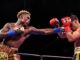 Jermell Charlo (left) rocked but couldn't finish Brian Castaño (right) in the second round of their 154-pound unification draw in July 2021. They'll rematch on Saturday with Charlo holding the IBF/WBA/WBC crowns, and Castano, the WBO version. (Premier Boxing Champions)