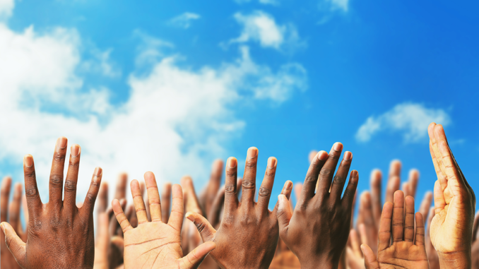 hands raised AdobeStock_111890698 copy