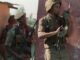 Members of the South African National Defense Force (SANDF) take up a position next to a shack in the black Umlazi township outside Durban, South Africa, as supporters of the African National Congress and the Inkatha Freedom Party clashed outside a stadium where President Nelson Mandela addressed a May Day rally, 01 May 1995. A new book looks at the legacy of Black African soldiers who fought in South African forces from the 1970s into the early 1990s. WALTER DHLADHLA/AFP via Getty Images)