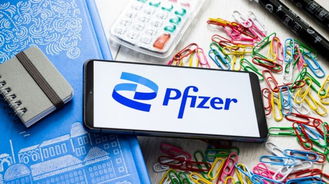 POLAND - 2023/03/07: In this photo illustration a Pfizer logo seen displayed on a smartphone. (Photo Illustration by Mateusz Slodkowski/SOPA Images/LightRocket via Getty Images)